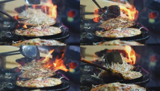 用铁锹在平底锅上翻炒炸虾的特写慢镜头，泰国传统食物，亚洲食物高清在线视频素材下载