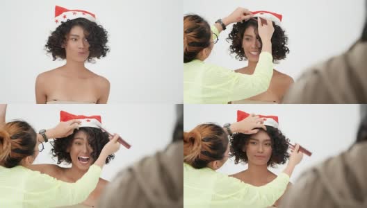 Makeup artist makes young black woman makeup and hair stylist高清在线视频素材下载