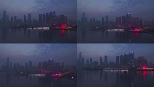 夜光青岛市海岸线著名的市中心海湾纪念碑广场航拍全景4k中国高清在线视频素材下载