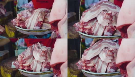 小贩在市场上用秤称肉高清在线视频素材下载