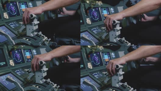 飞行员手握飞机发动机控制的推力杆手柄。高清在线视频素材下载