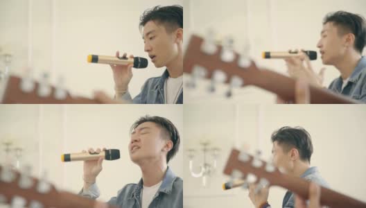 年轻的亚洲男歌手排练高清在线视频素材下载