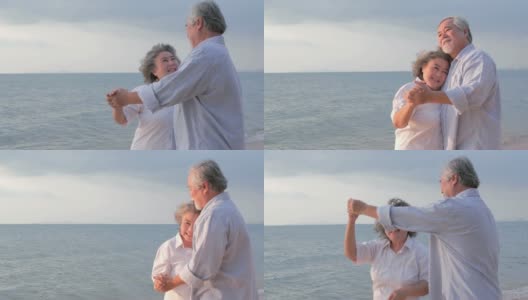 亚洲高年级情侣在沙滩上跳舞一起笑。有生活方式、情感和退休观念的人。高清在线视频素材下载