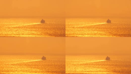 希腊圣托里尼岛，远处的游船轮廓在夕阳中远去。高清在线视频素材下载