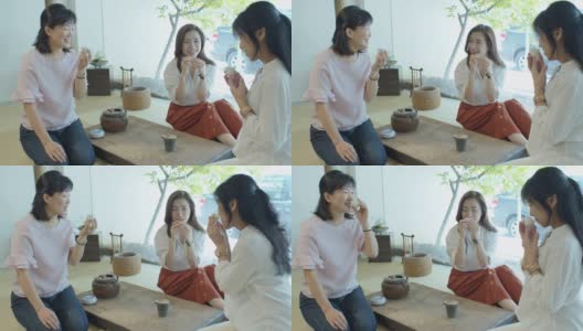 三个中国妇女坐在榻榻米上喝茶高清在线视频素材下载