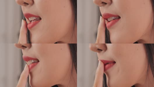美丽女人的嘴唇在白色的背景。高清在线视频素材下载