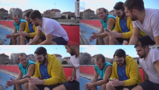 男性朋友打完篮球后坐在看台上高清在线视频素材下载