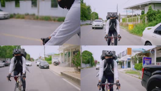 披着保暖背包的快递员在路上骑自行车。高清在线视频素材下载