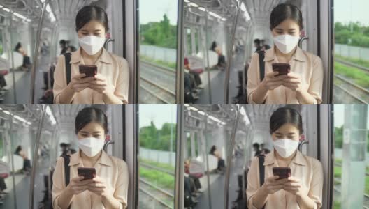 年轻女子在火车上用手机和短信高清在线视频素材下载