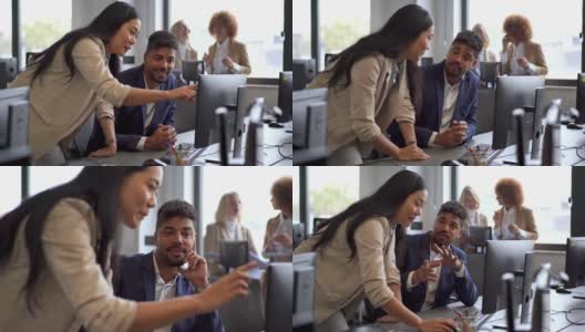 快乐的多种族男女商人在办公室里用电脑一起工作高清在线视频素材下载