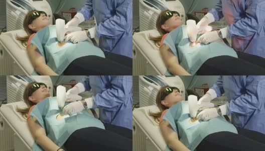 近距离观察:医生使用激光医疗设备对患者的痣去除高清在线视频素材下载