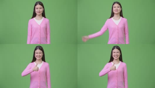 年轻美丽的亚洲女人竖起大拇指高清在线视频素材下载