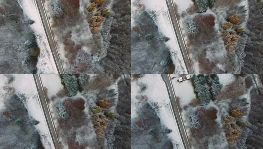 多雪的冬天道路和树林的天线高清在线视频素材下载