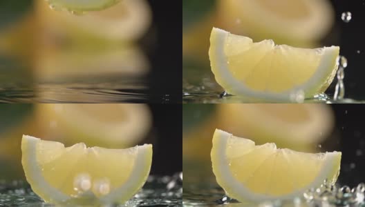 近距离观察柠檬片撞击淡水表面。慢动作镜头高清在线视频素材下载