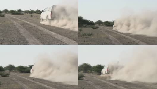 汽车行驶在尘土飞扬的非洲丛林中，博茨瓦纳高清在线视频素材下载