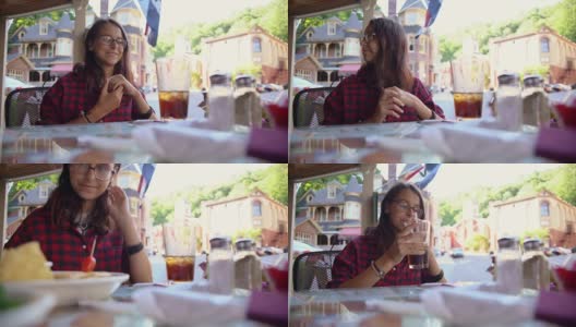 宾夕法尼亚州波科诺斯地区的吉姆·索普，一个16岁的漂亮女孩正在街边的咖啡馆里吃饭高清在线视频素材下载