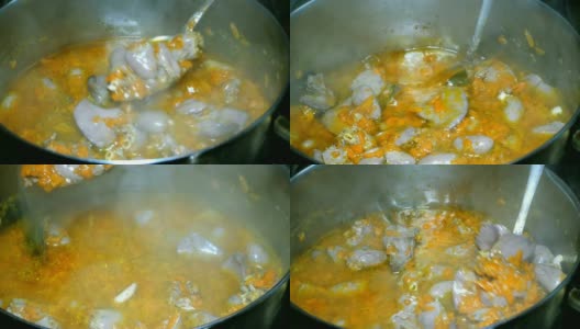 烹饪自制的食物。炖牛肉或用胡萝卜煮的鸡内脏浓汤。高清在线视频素材下载