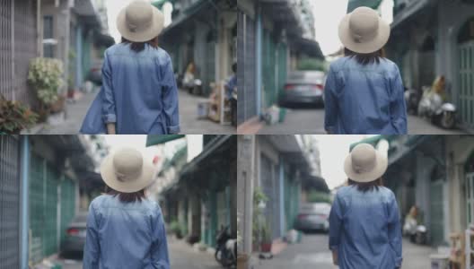 年轻的亚洲女性旅行者的肖像戴着复古软呢帽走在泰国曼谷的一条小街上。享受暑假旅行。单独旅行的概念。高清在线视频素材下载