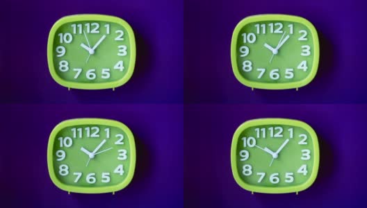 绿色时钟与白色数字和箭头隔离在靛蓝色背景，实时高清在线视频素材下载