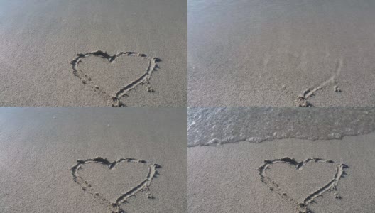 画在沙滩上的心的形状，被轻柔的海浪冲走。海上度假。一个爱情故事的概念和一个浪漫的假期。高清在线视频素材下载