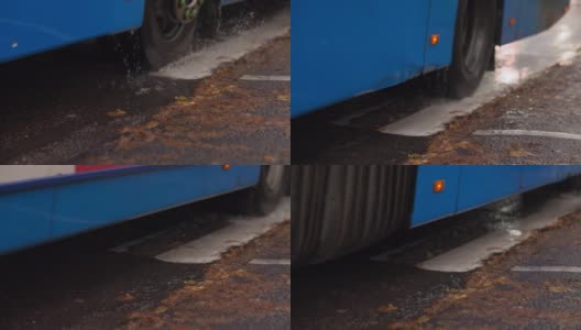 公共汽车开过水坑高清在线视频素材下载