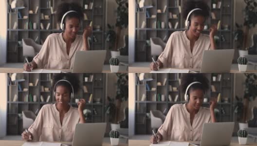 混血女性戴着耳机在线收听在线学习音频课程高清在线视频素材下载