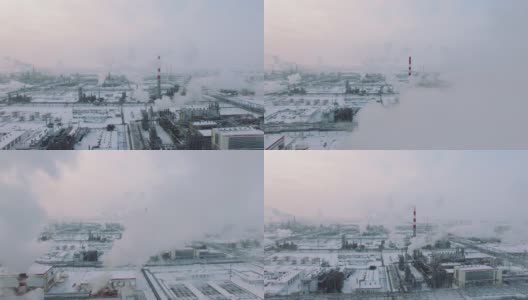 暴风雪天气和降雪。冬季天然气处理厂鸟瞰图。寒冷的早晨在工业区高清在线视频素材下载