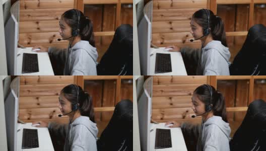 一个年轻的女孩在家里通过电脑在线课程学习高清在线视频素材下载