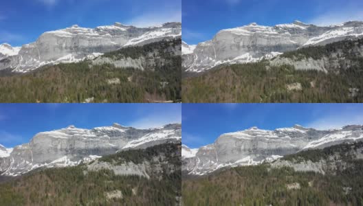 在一个阳光明媚的春天，在欧洲的勃朗峰，在法国的阿尔卑斯山，在夏蒙尼，积雪覆盖的岩石。高清在线视频素材下载