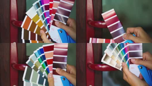 根据RAL公司Tikkurila的布局，选择门把手的油漆颜色。修复和施工，覆盖小碎片。2021年10月29日，俄罗斯卡卢加高清在线视频素材下载