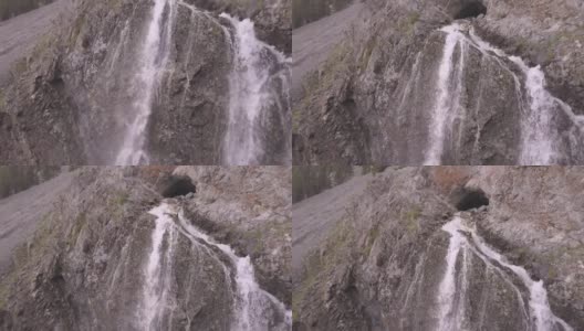 水从崖壁上的洞穴口流出高清在线视频素材下载
