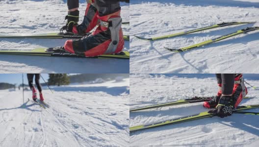 越野滑雪者走到他的滑雪板上，把它们绑好高清在线视频素材下载