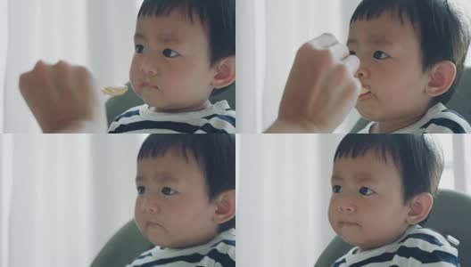 可爱的婴儿吃婴儿食品高清在线视频素材下载