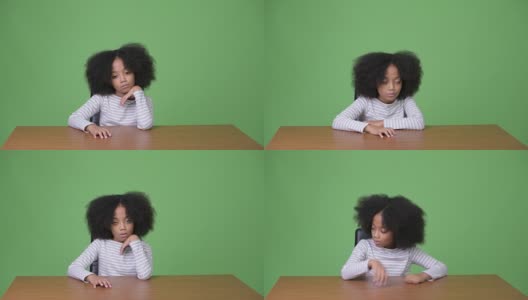 年轻可爱的非洲女孩与非洲发型感到无聊高清在线视频素材下载