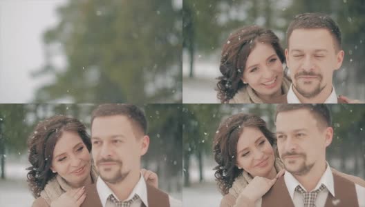 一对情侣在冬日雪地上接吻。慢动作高清在线视频素材下载