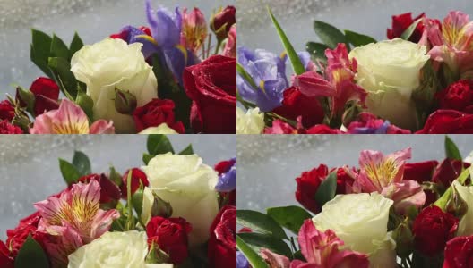 美丽的玫瑰花束，鸢尾和紫花旋转高清在线视频素材下载