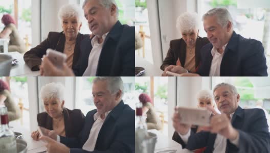 老年夫妇在餐厅使用手机高清在线视频素材下载