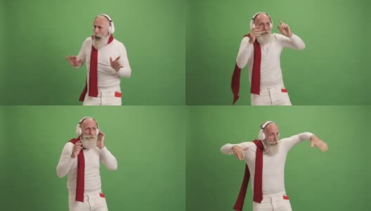 一位看起来像圣诞老人的老人用智能手机听音乐、跳舞、唱歌。在绿色的背景上。一个人。高清在线视频素材下载