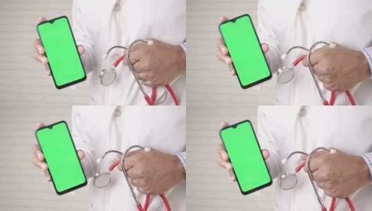医生在乳胶手套手持智能手机与空屏幕高清在线视频素材下载