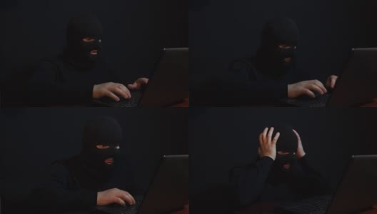 高度危险的黑客。一个蒙面男子对着摄像机说话。高清在线视频素材下载
