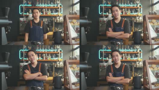咖啡店老板的4K亚洲男人肖像，双手交叉站在吧台前高清在线视频素材下载