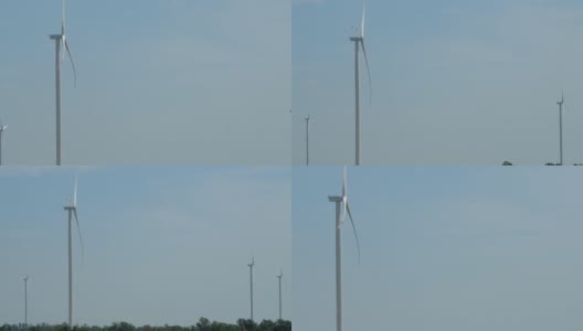 带旋转螺旋桨的风车在野外产生能量高清在线视频素材下载