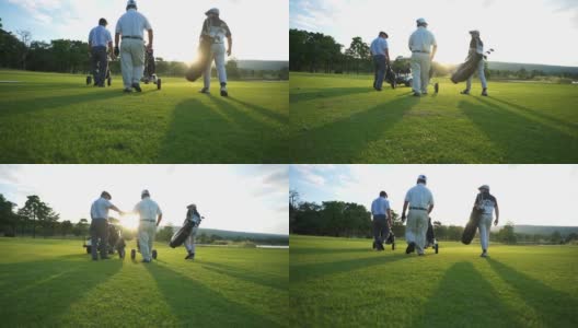 在夏日夕阳下，亚洲商人和高级CEO一起拿着高尔夫球袋漫步在高尔夫球道上高清在线视频素材下载