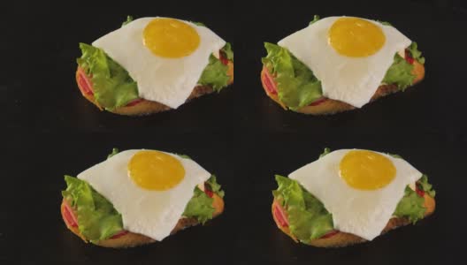 俯瞰美味的新鲜三明治，烤面包，绿色沙拉，鸡蛋，火腿高清在线视频素材下载