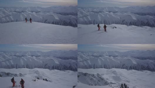 滑雪者站在山顶上高清在线视频素材下载