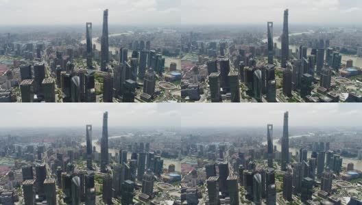 无人机拍摄:晴朗天空下上海天际线的4K鸟瞰图高清在线视频素材下载