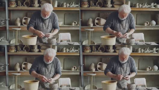 一位经验丰富的手工艺人在舒适的工作环境中制作陶瓷碗，并将其固定在陶器上。陶艺、职业、爱好概念。高清在线视频素材下载