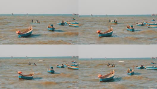 小渔船在波涛汹涌的海面上航行。渔民在海里捉鱼高清在线视频素材下载