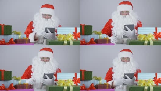 圣诞老人用平板电脑，笑起来是50fps高清在线视频素材下载