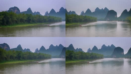 漓江上的游船，背景是喀斯特山脉高清在线视频素材下载